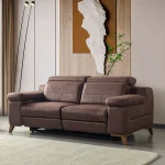 A detailed view of the Serena Motorized Double Recliner, a premium brown double sofa manufactured by Chairium, featuring extended motorized footrests and adjustable motorized headrests.