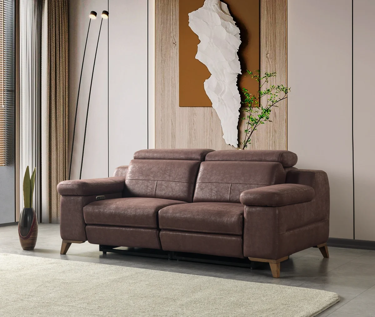 A detailed view of the Serena Motorized Double Recliner, a premium brown double sofa manufactured by Chairium, featuring extended motorized footrests and adjustable motorized headrests.