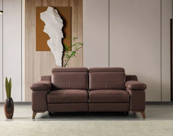 A detailed view of the Serena Motorized Double Recliner, a premium brown double sofa manufactured by Chairium, featuring extended motorized footrests and adjustable motorized headrests.