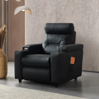 A front-facing view of the ZERO PLUS recliner, a luxurious black leather recliner chair with ergonomic stitched paneling and built-in cup holders. The recliner is centered on a light rug in a modern living room setting featuring elegant wood wall panels, accompanied by a tall woven vase holding decorative dry grass.